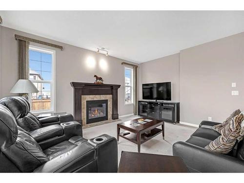 217 Cranarch Close Se, Calgary, AB - Indoor Photo Showing Living Room With Fireplace