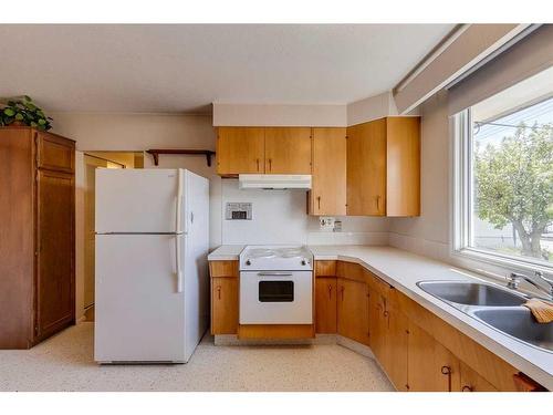 2131 Munro Drive Ne, Calgary, AB - Indoor Photo Showing Kitchen With Double Sink