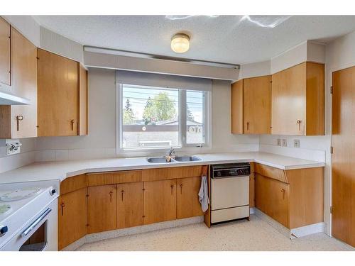 2131 Munro Drive Ne, Calgary, AB - Indoor Photo Showing Kitchen With Double Sink