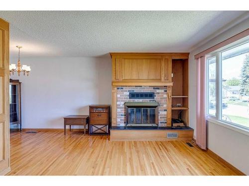 2131 Munro Drive Ne, Calgary, AB - Indoor Photo Showing Living Room With Fireplace