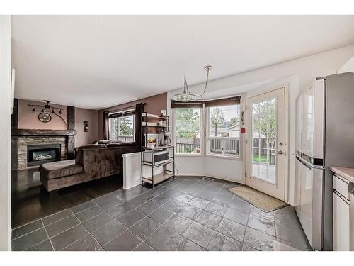 144 Riverglen Drive Se, Calgary, AB - Indoor With Fireplace