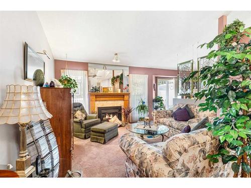 119 Gladstone Gardens Sw, Calgary, AB - Indoor Photo Showing Living Room With Fireplace