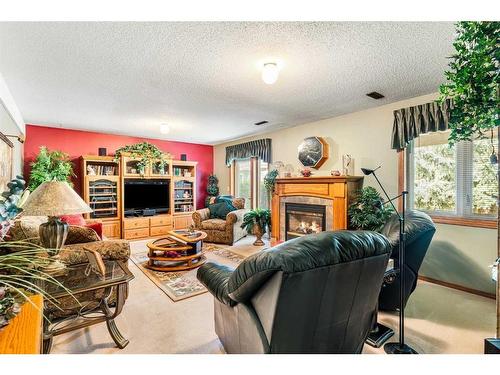 119 Gladstone Gardens Sw, Calgary, AB - Indoor Photo Showing Living Room With Fireplace