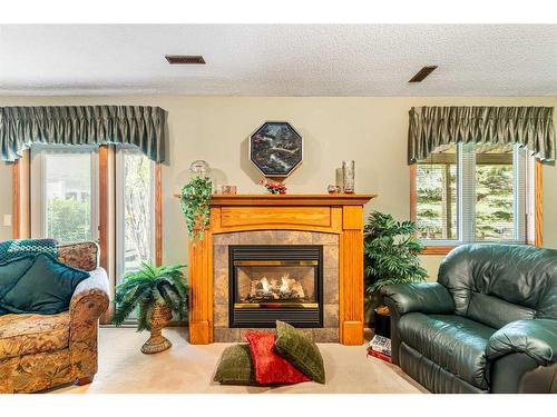 119 Gladstone Gardens Sw, Calgary, AB - Indoor Photo Showing Living Room With Fireplace