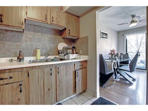 69-2519 38 Street Ne, Calgary, AB - Indoor Photo Showing Kitchen With Double Sink