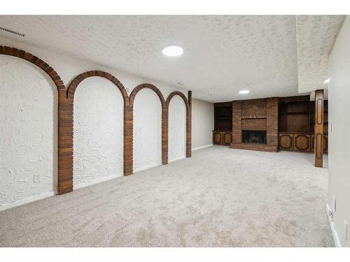 428 Penworth Rise Se, Calgary, AB - Indoor With Fireplace