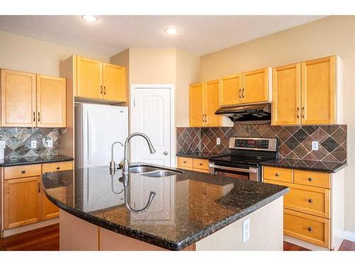 219 Panamount Circle Nw, Calgary, AB - Indoor Photo Showing Kitchen With Double Sink