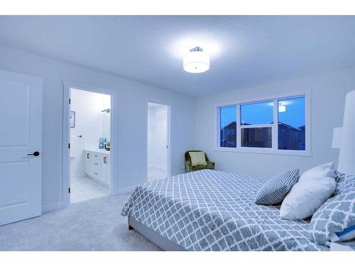 1125 Bayview Gardens Sw, Airdrie, AB - Indoor Photo Showing Bedroom