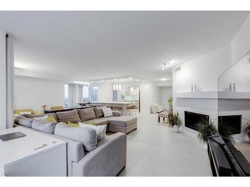 2703-1100 8 Avenue Sw, Calgary, AB - Indoor Photo Showing Living Room With Fireplace