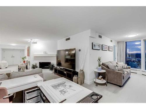 2703-1100 8 Avenue Sw, Calgary, AB - Indoor Photo Showing Living Room With Fireplace