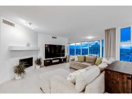 2703-1100 8 Avenue Sw, Calgary, AB - Indoor Photo Showing Living Room With Fireplace