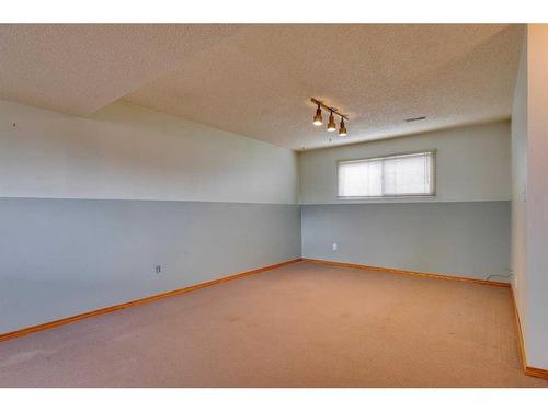 24 Radcliffe Bay Se, Calgary, AB - Indoor Photo Showing Other Room