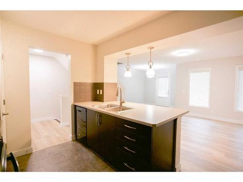 104 Windstone Link Sw, Airdrie, AB - Indoor Photo Showing Kitchen With Double Sink