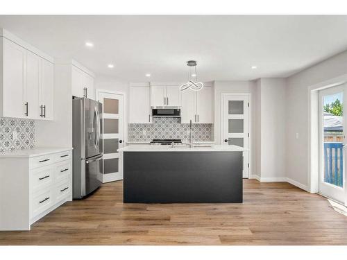 113 Somerset Drive Sw, Calgary, AB - Indoor Photo Showing Kitchen With Stainless Steel Kitchen With Upgraded Kitchen