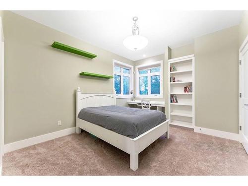 100-8014 338 Avenue East, Rural Foothills County, AB - Indoor Photo Showing Bedroom