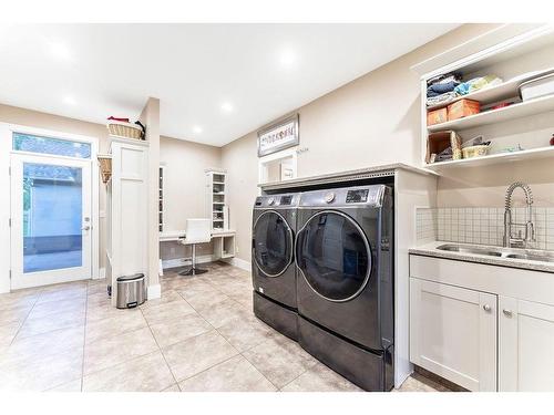 100-8014 338 Avenue East, Rural Foothills County, AB - Indoor Photo Showing Laundry Room