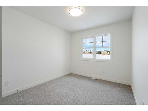 120 Heritage Boulevard, Cochrane, AB - Indoor Photo Showing Other Room