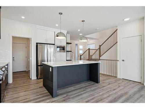 120 Heritage Boulevard, Cochrane, AB - Indoor Photo Showing Kitchen With Upgraded Kitchen