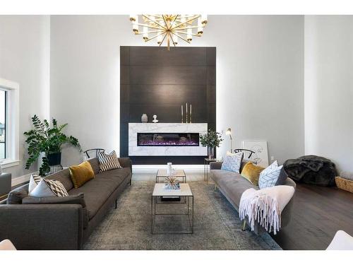 30 Dunes Drive, Desert Blume, AB - Indoor Photo Showing Living Room With Fireplace