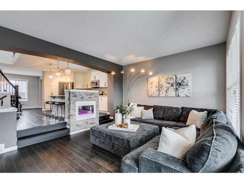 258 Auburn Crest Green Se, Calgary, AB - Indoor Photo Showing Living Room With Fireplace