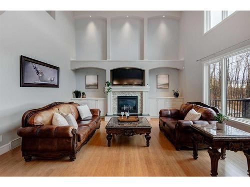 84 Gray Way, Rural Rocky View County, AB - Indoor Photo Showing Living Room With Fireplace