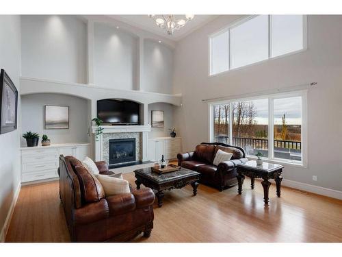 84 Gray Way, Rural Rocky View County, AB - Indoor Photo Showing Living Room With Fireplace