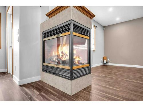 104 Taracove Crescent Ne, Calgary, AB - Indoor Photo Showing Other Room With Fireplace