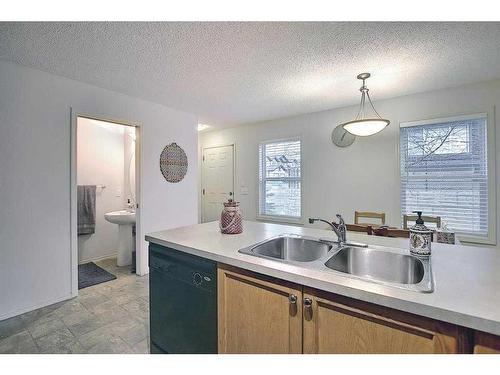 4 Panatella Street Nw, Calgary, AB - Indoor Photo Showing Kitchen With Double Sink