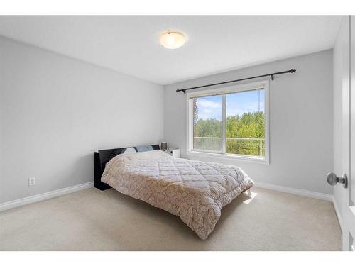 85 Royal Highland Road Nw, Calgary, AB - Indoor Photo Showing Bedroom