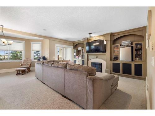 121 Aspen Glen Place Sw, Calgary, AB - Indoor Photo Showing Living Room With Fireplace