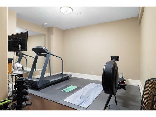 121 Aspen Glen Place Sw, Calgary, AB - Indoor Photo Showing Gym Room