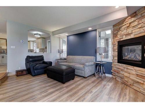 29 Lakeside Greens Close, Chestermere, AB - Indoor Photo Showing Living Room With Fireplace