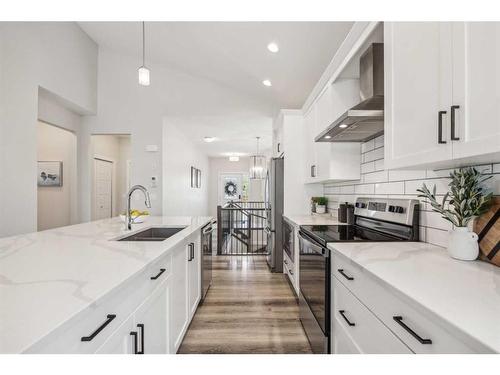 78 Bayview Circle Sw, Airdrie, AB - Indoor Photo Showing Kitchen With Double Sink With Upgraded Kitchen