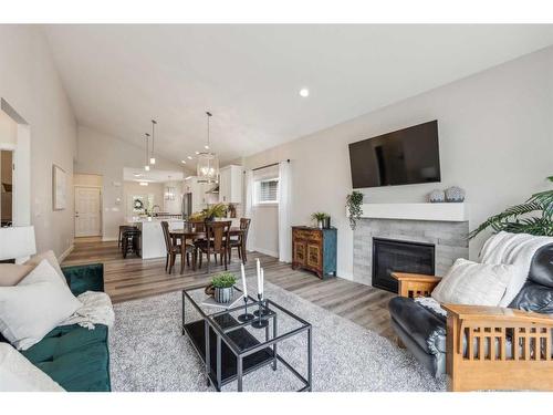 78 Bayview Circle Sw, Airdrie, AB - Indoor Photo Showing Living Room With Fireplace