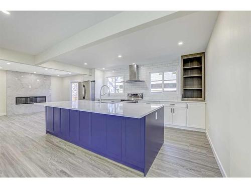 100 Deermeade Road Se, Calgary, AB - Indoor Photo Showing Kitchen With Upgraded Kitchen