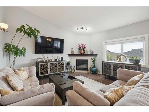 516 Rocky Vista Gardens Nw, Calgary, AB - Indoor Photo Showing Living Room With Fireplace