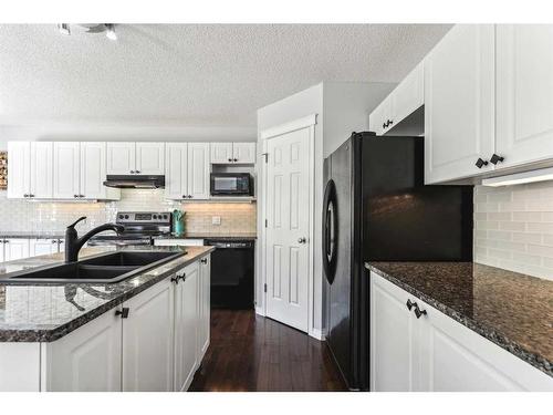 83 Chapala Way Se, Calgary, AB - Indoor Photo Showing Kitchen With Double Sink