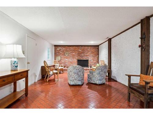 265 Wildwood Drive Sw, Calgary, AB - Indoor Photo Showing Living Room With Fireplace