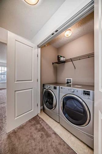 64 Covecreek Mews Ne, Calgary, AB - Indoor Photo Showing Laundry Room