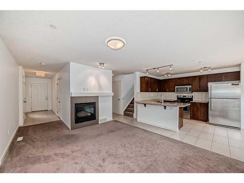 64 Covecreek Mews Ne, Calgary, AB - Indoor With Fireplace