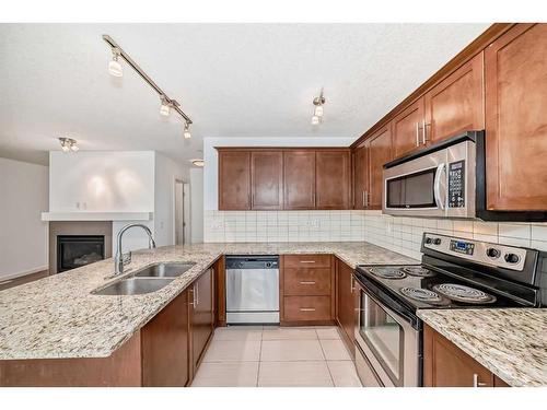 64 Covecreek Mews Ne, Calgary, AB - Indoor Photo Showing Kitchen With Double Sink