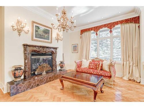 19 Pump Hill Close Sw, Calgary, AB - Indoor Photo Showing Living Room With Fireplace