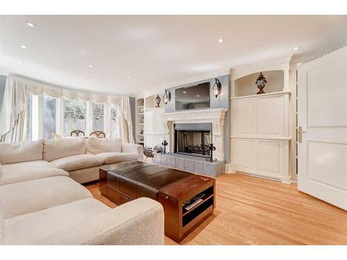 19 Pump Hill Close Sw, Calgary, AB - Indoor Photo Showing Living Room With Fireplace