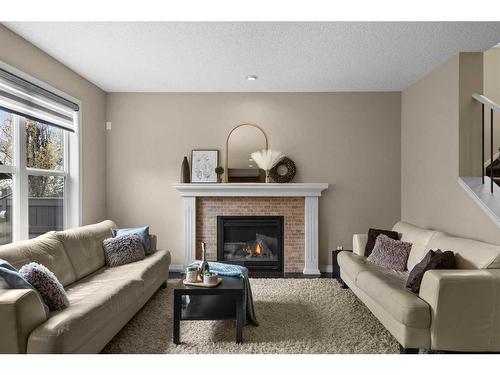 88 Auburn Glen Gardens Se, Calgary, AB - Indoor Photo Showing Living Room With Fireplace