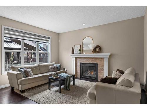 88 Auburn Glen Gardens Se, Calgary, AB - Indoor Photo Showing Living Room With Fireplace