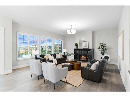 25 Stillwater Bay, Heritage Pointe, AB - Indoor Photo Showing Living Room With Fireplace