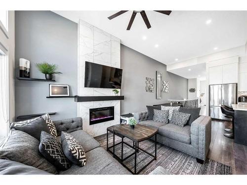 31 D'Arcy Boulevard, Okotoks, AB - Indoor Photo Showing Living Room With Fireplace