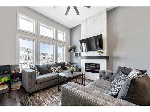 31 D'Arcy Boulevard, Okotoks, AB - Indoor Photo Showing Living Room With Fireplace