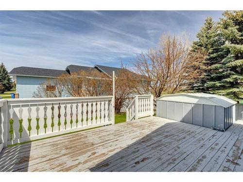 273 Woodside Road Nw, Airdrie, AB - Outdoor With Above Ground Pool With Deck Patio Veranda