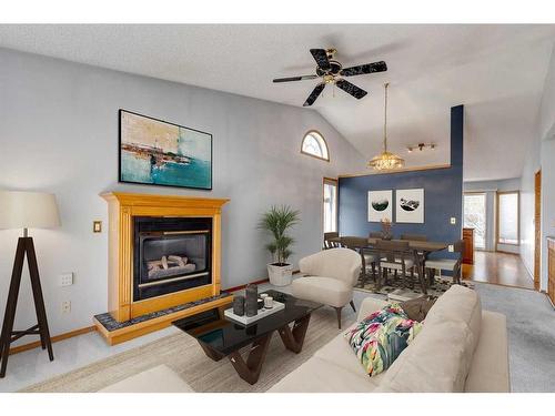 273 Woodside Road Nw, Airdrie, AB - Indoor Photo Showing Living Room With Fireplace